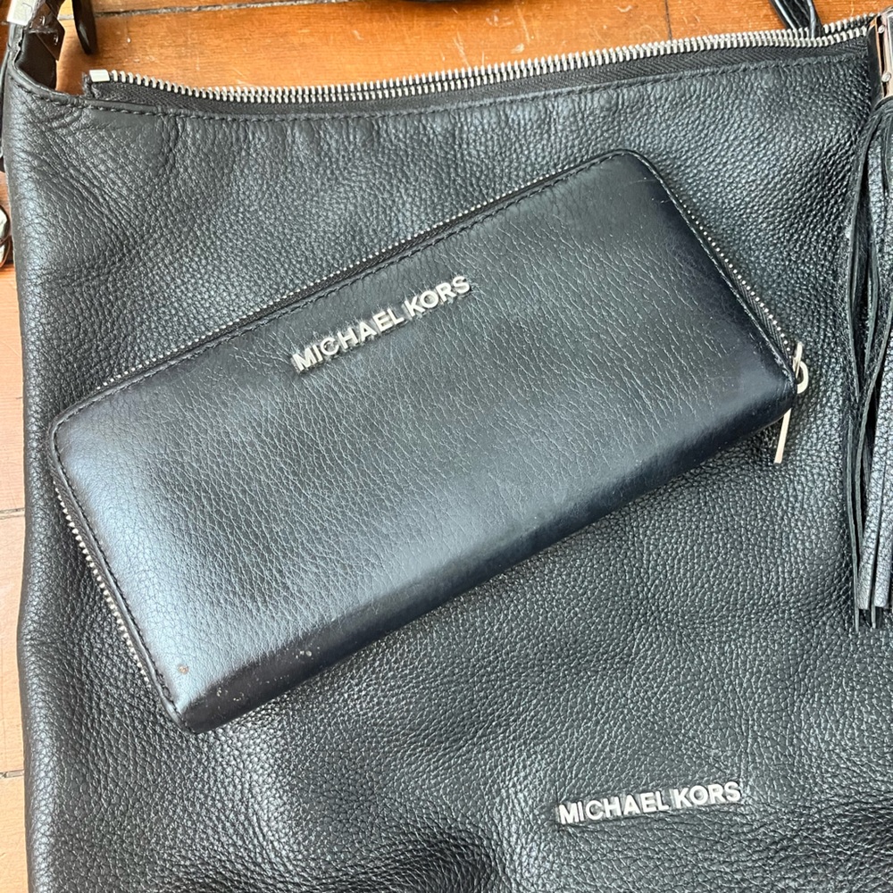 Like new Michael Kors cross body and matching wallet with dust cover